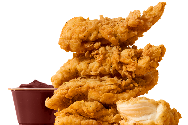 Broaster chicken tenders stacked next to BBQ sauce