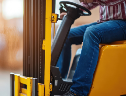 Person driving forklift